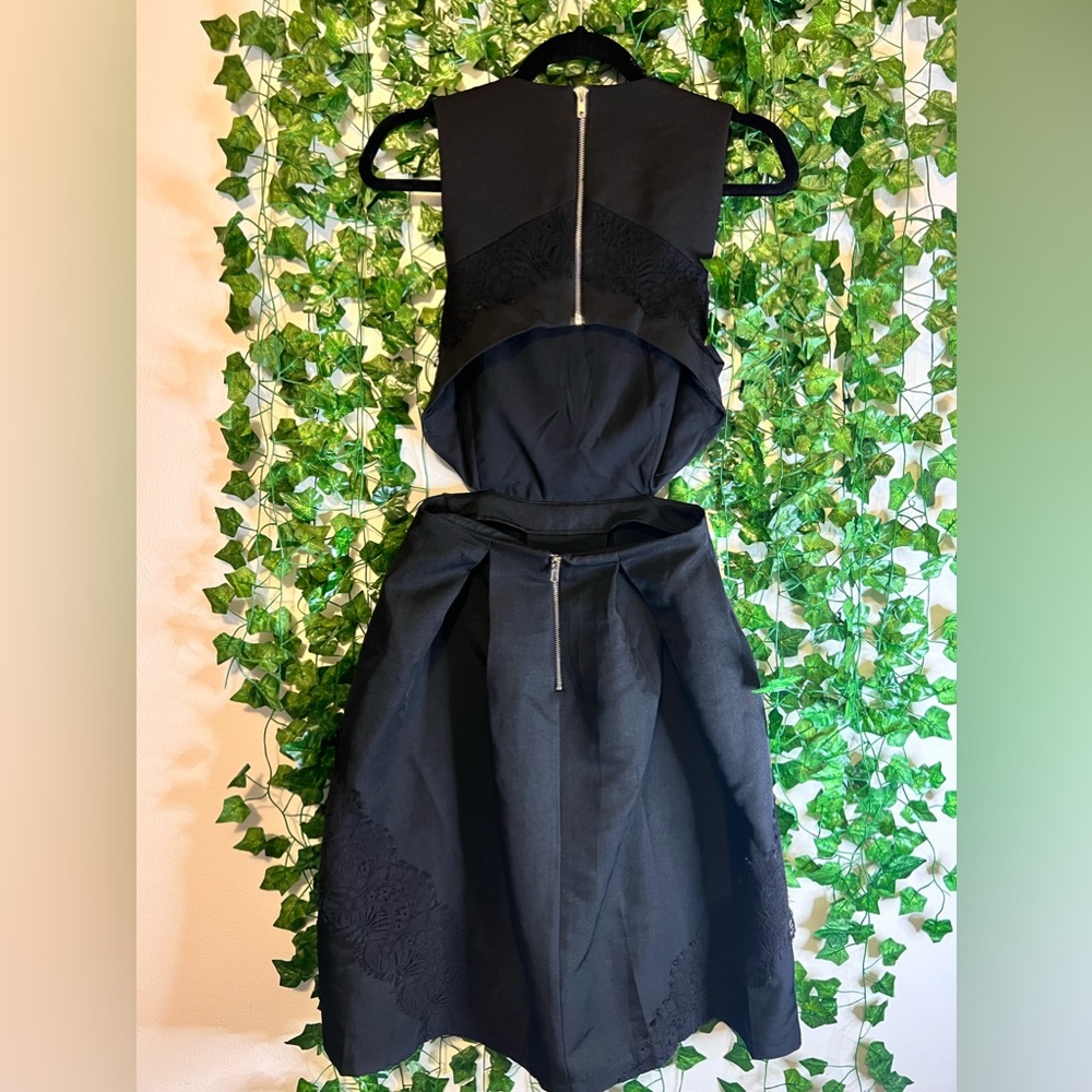 Great little black dress for any event! The back is partially out.
